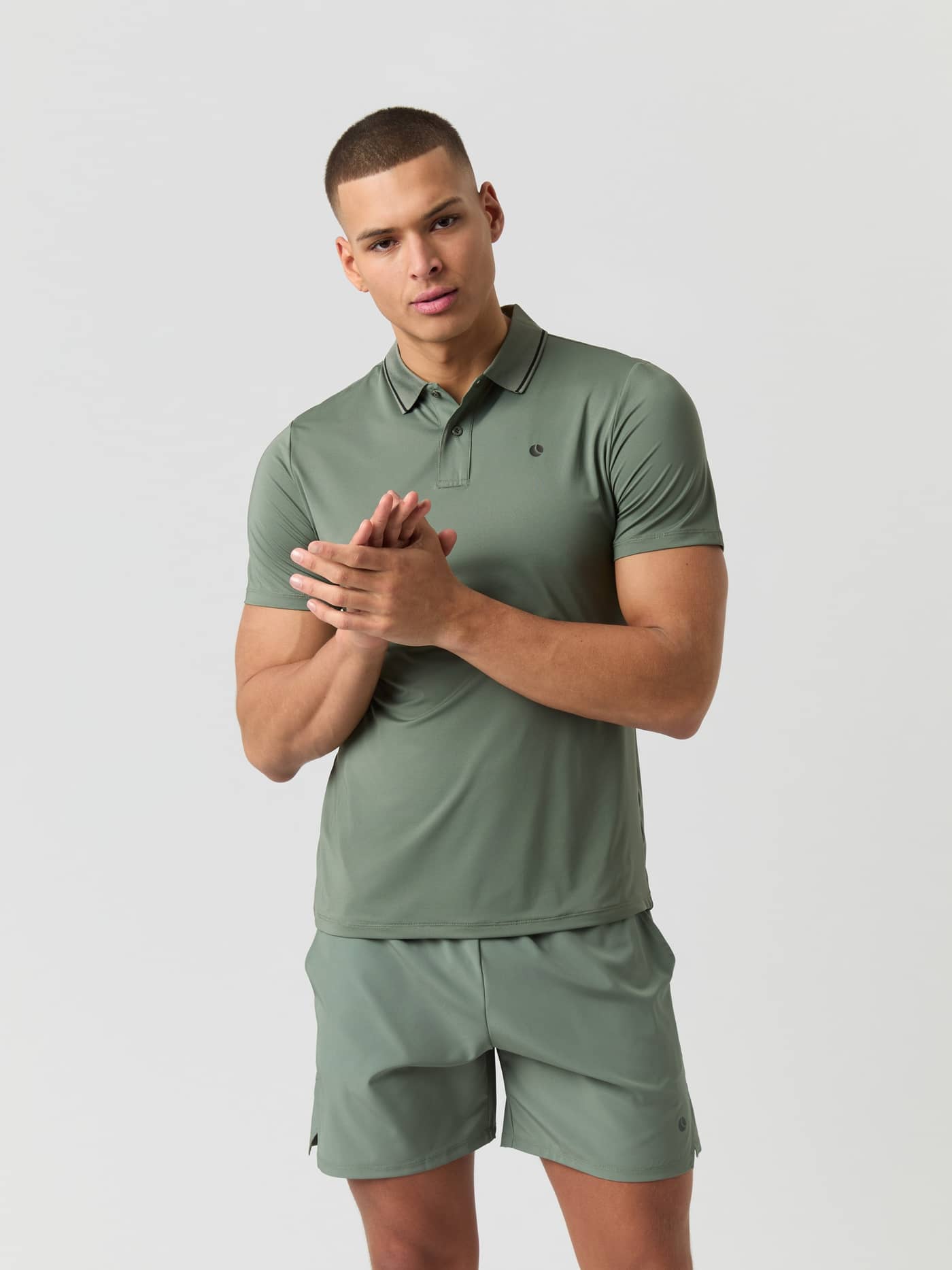 Front view of a male model wearing the Björn Borg Ace Polo Shirt in Agave Green. - Image 1