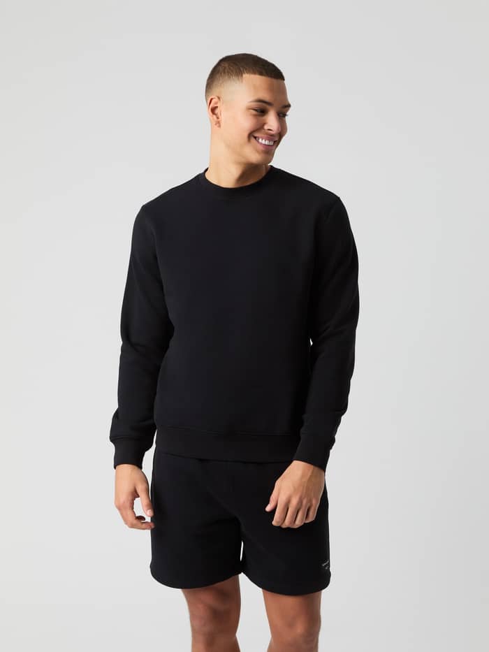 Front view of a model wearing the Björn Borg Centre Sweatshirt in black.