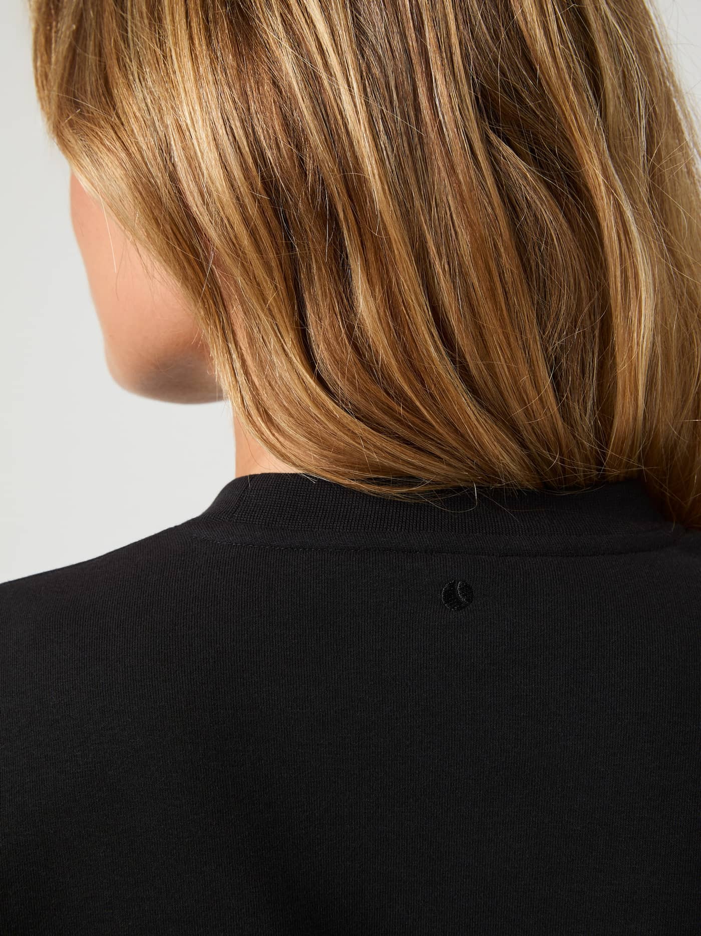 Close-up back view of the Björn Borg Centre Sweatshirt in Black Beauty (Black), featuring the ribbed neck and tonal logo. - Image 4