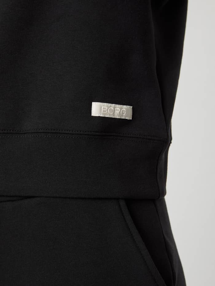 Weißes gewebtes Logo an der Hüfte des Björn Borg Centre Sweatshirt für Damen in Black Beauty (Schwarz). - Image 5