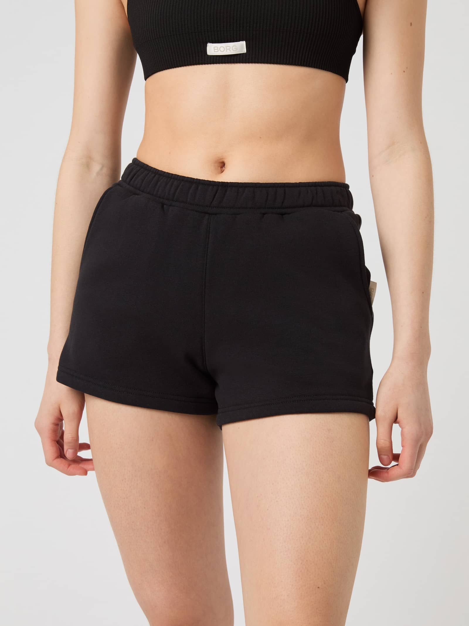 Front view of the women's Björn Borg Centre Sweatshorts in Black Beauty (Black) featuring a regular fit and soft fleece. - Image 1