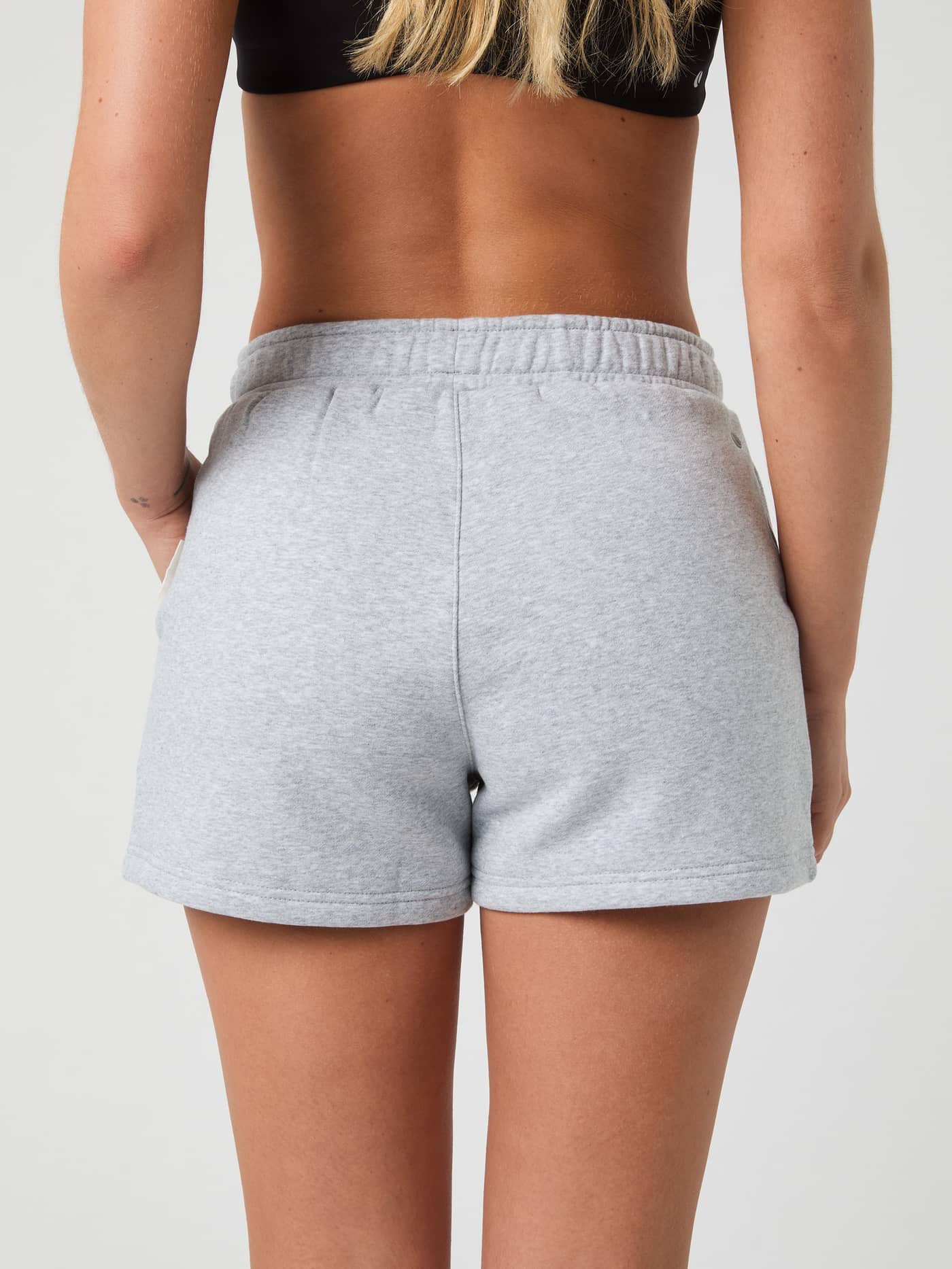 Back view of a model wearing the Björn Borg Centre Sweatshorts in Light Grey Melange (Grey) with a soft, regular fit. - Image 3