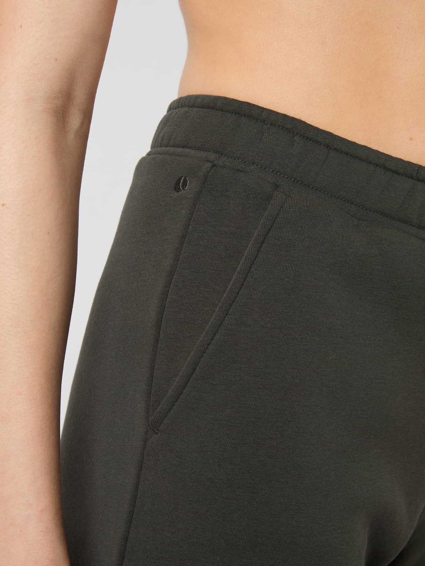Detailed close-up of the side pocket and soft fleece on the Peat (Green) Björn Borg Centre Sweatshorts. - Image 5
