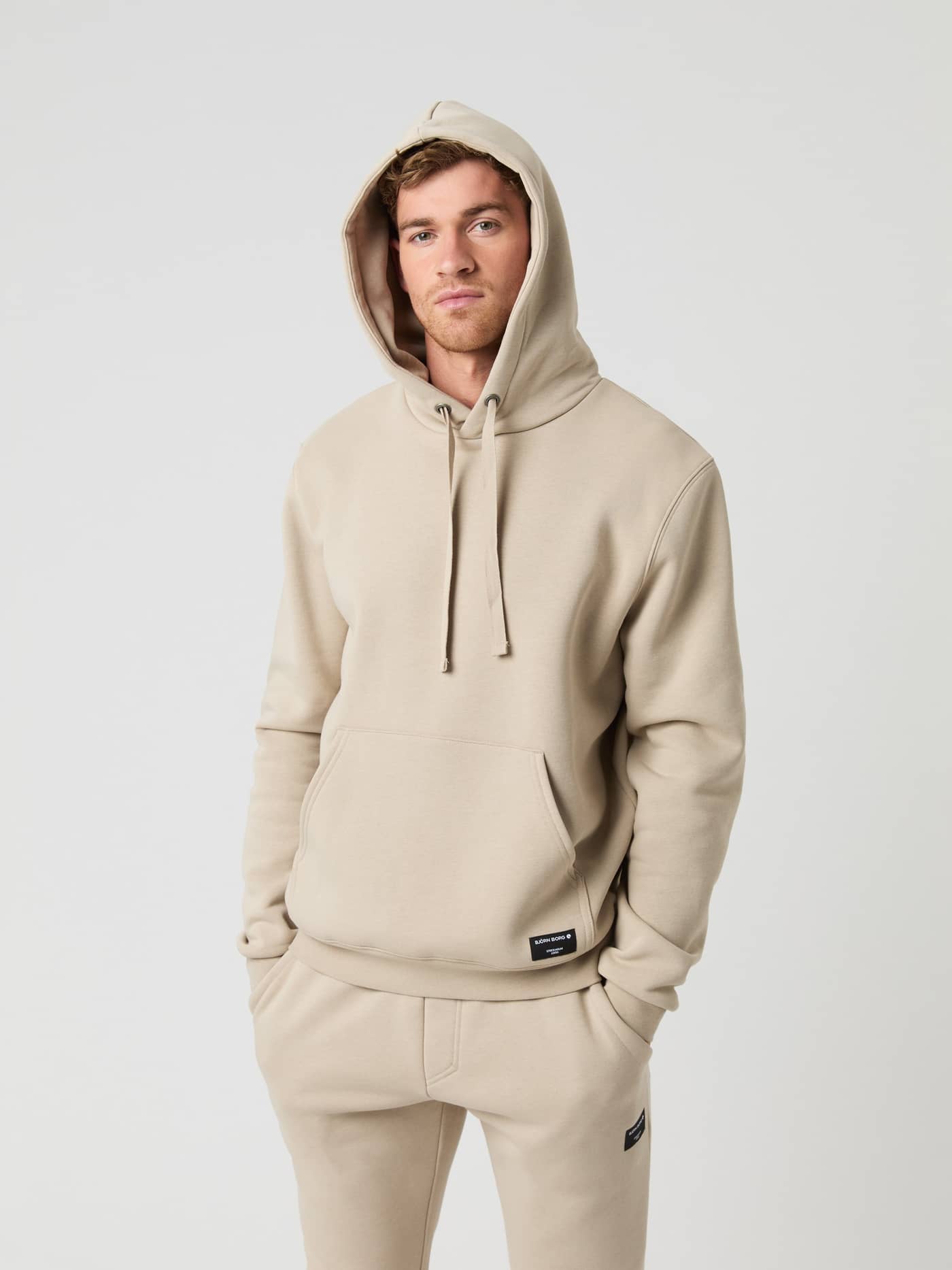 Male model wearing the Björn Borg Centre Hoodie in Pure Cashmere with the hood up. - Image 1