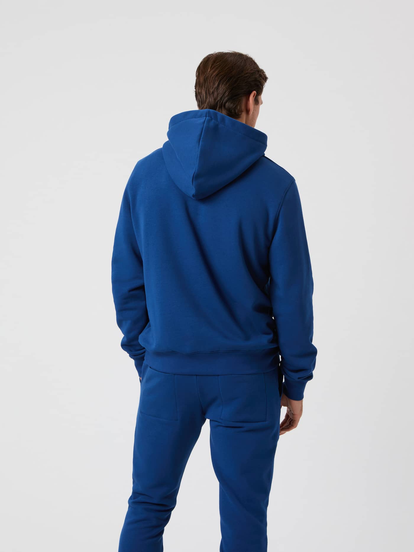 Back view of a man wearing the Björn Borg Centre Hoodie in Estate Blue. - Image 3