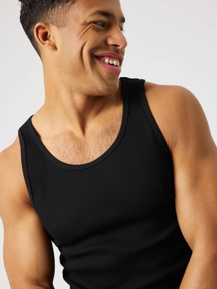 Detailed close-up of the Björn Borg Centre Ribbed Tank in Black Beauty (Black) featuring a slim fit and ribbed texture. - Image 5