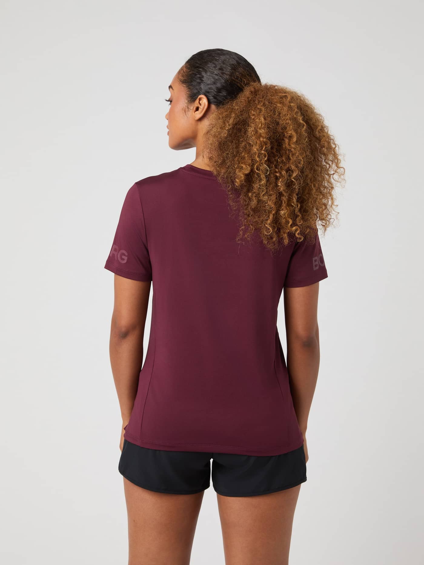 Back view of a female model wearing the Borg T-Shirt in Port Royale. - Image 2