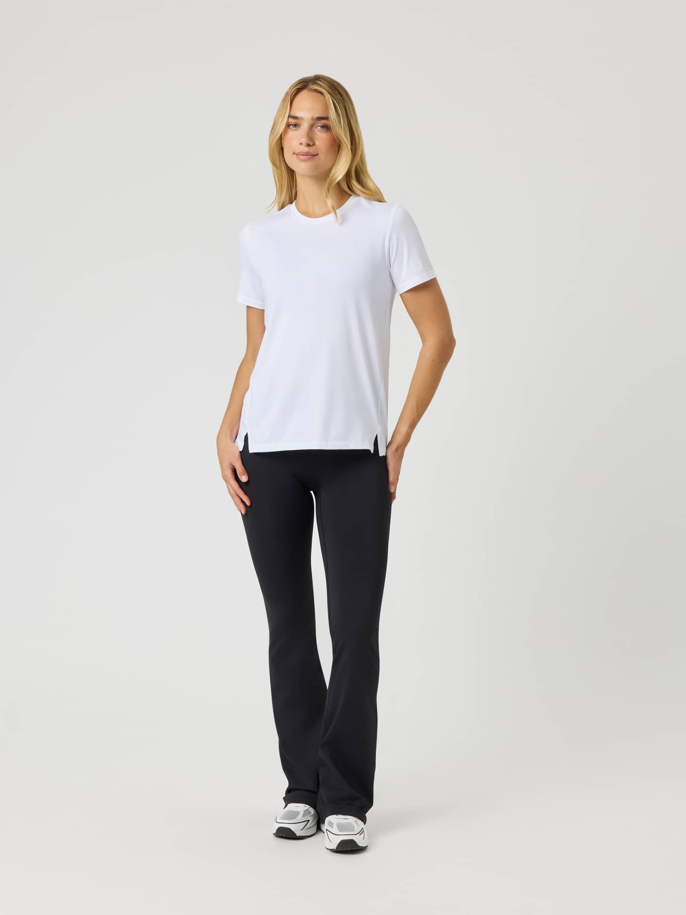 Front view of a model in the Borg T-Shirt in Brilliant White (White), a recycled training top with white logos for tennis. - Image 3