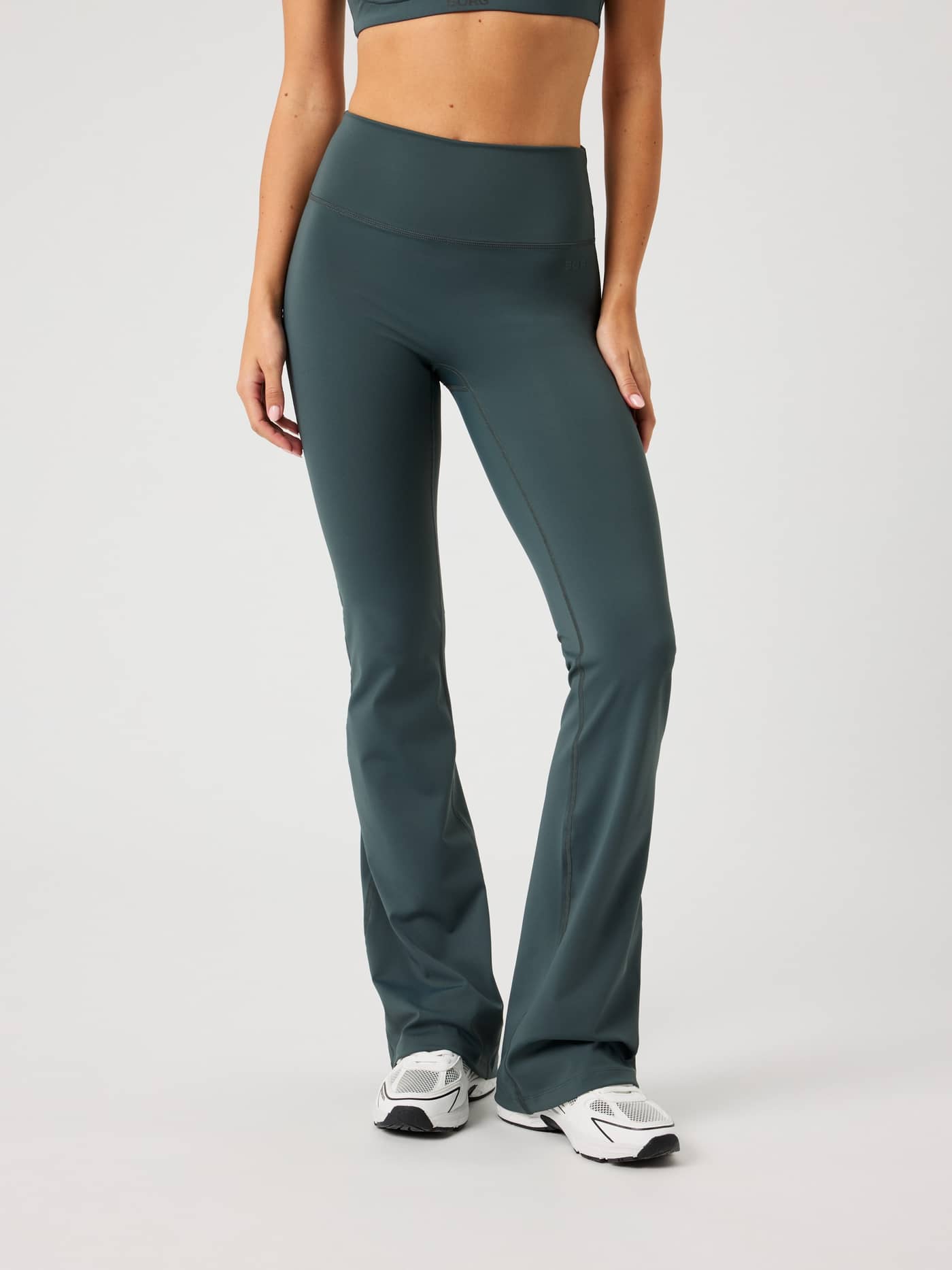 Front view of the Borg Flare Tights Tall in Urban Chic (Green), with a slim fit and bootcut legs for training performance. - Image 1