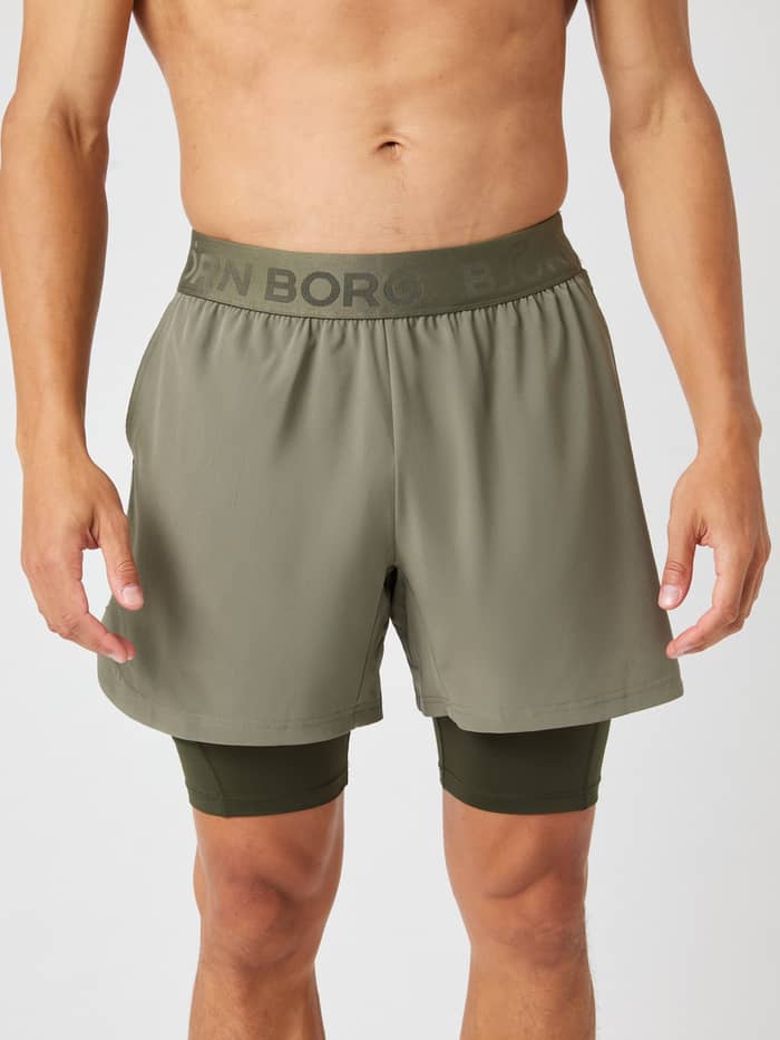 Front view of training Borg 2 In 1 Shorts in Dusty Olive (Green) featuring a tonal logo waistband for performance.