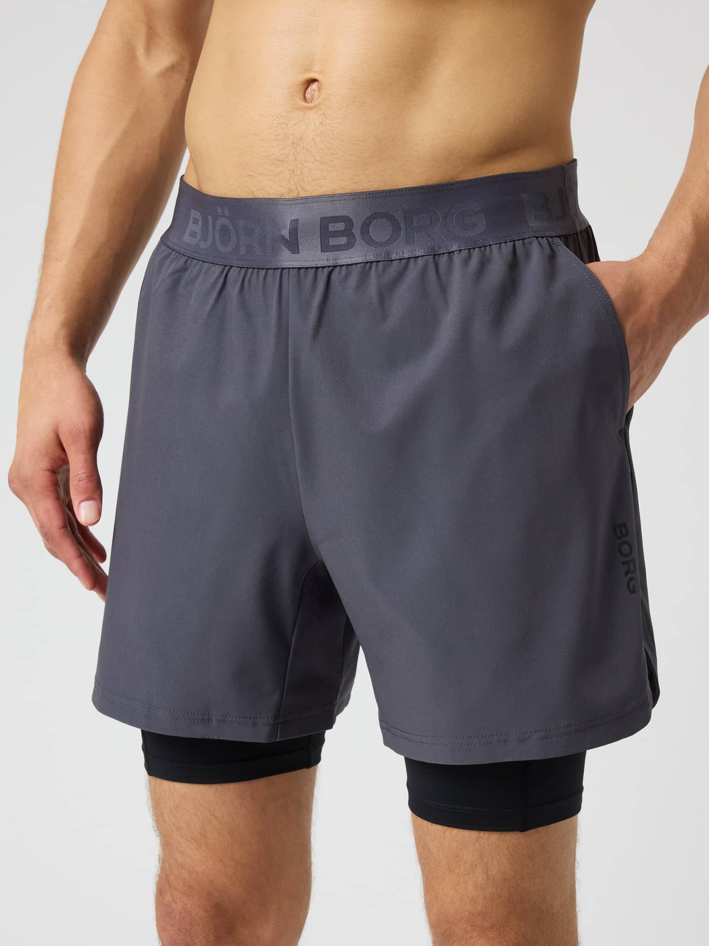 Front view of Borg 2 In 1 Shorts in Asphalt (Grey) with a branded waistband and black inner shorts for gym training. - Image 1