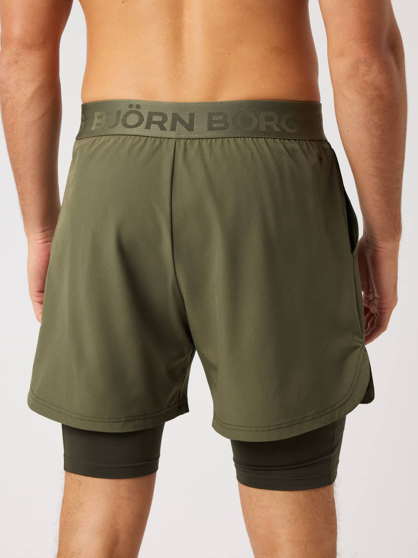 Back view of Borg 2 In 1 Shorts in Kalamata (Green) with a tonal green logo waistband and inner shorts for tennis training. - Image 2