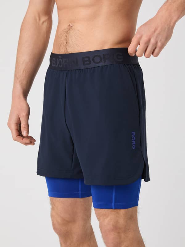 Borg 2 In 1 Shorts en Night sky (Marino) para hombre con logo azul y capa interior para entrenamiento.
