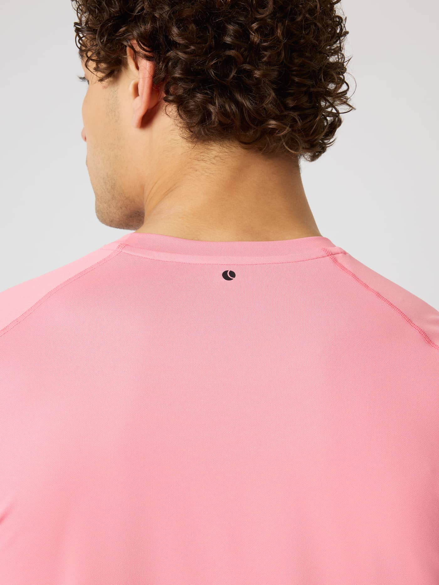 Borg Athletic T-Shirt in Strawberry Ice (Pink) featuring a black logo on the back neck for tennis and training. - Image 4
