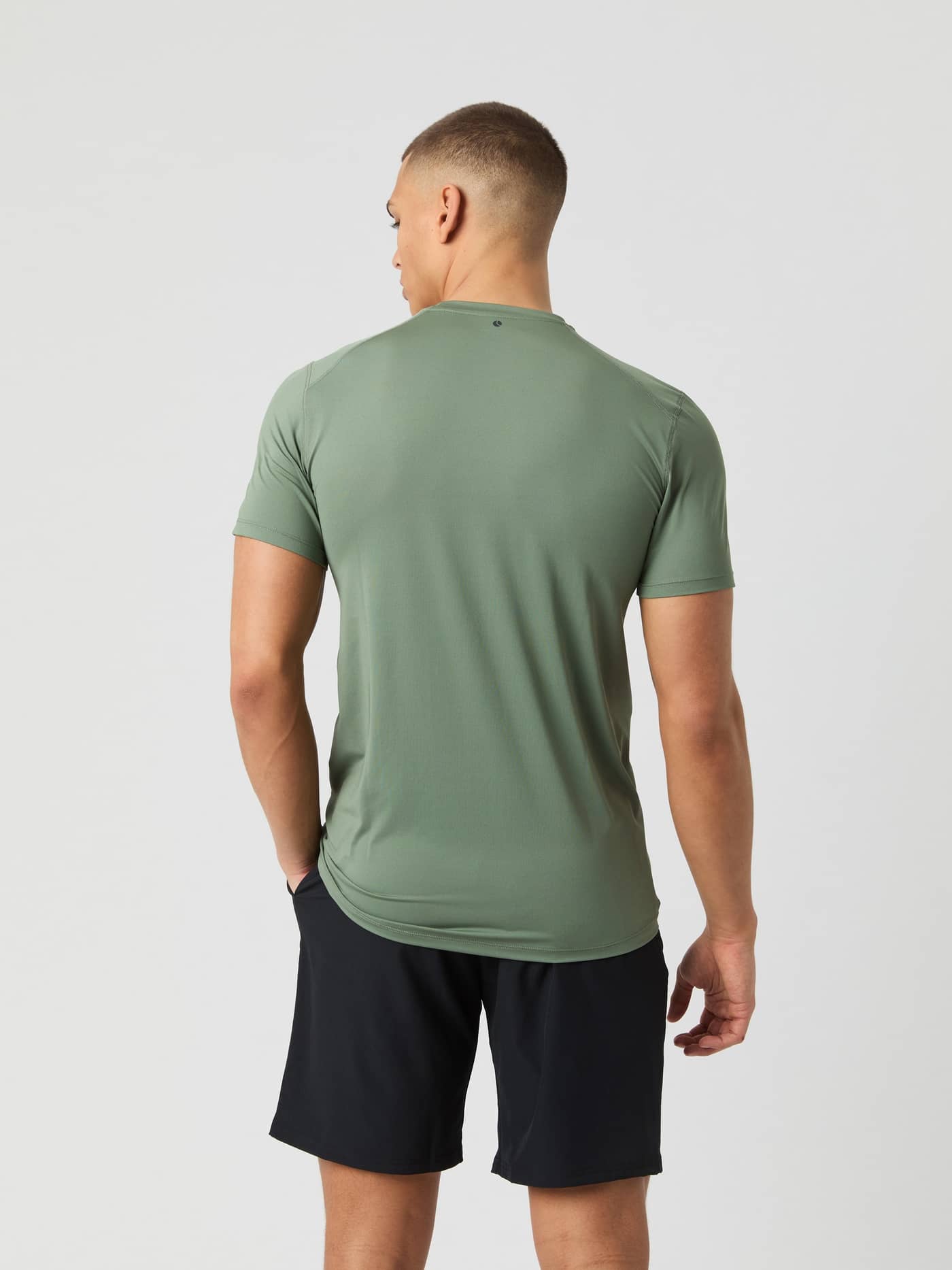 Back view of a model wearing the Björn Borg Athletic T-Shirt in Agave Green. - Image 2