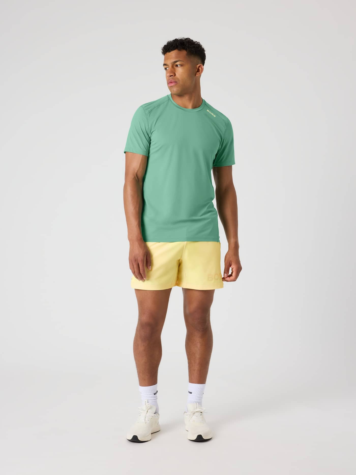 Full-body front view of a man wearing the Borg Athletic T-Shirt in Malachite Green (Green) for performance training. - Image 3