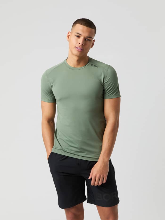 Front view of a model wearing the Borg Athletic T-Shirt in Agave Green.