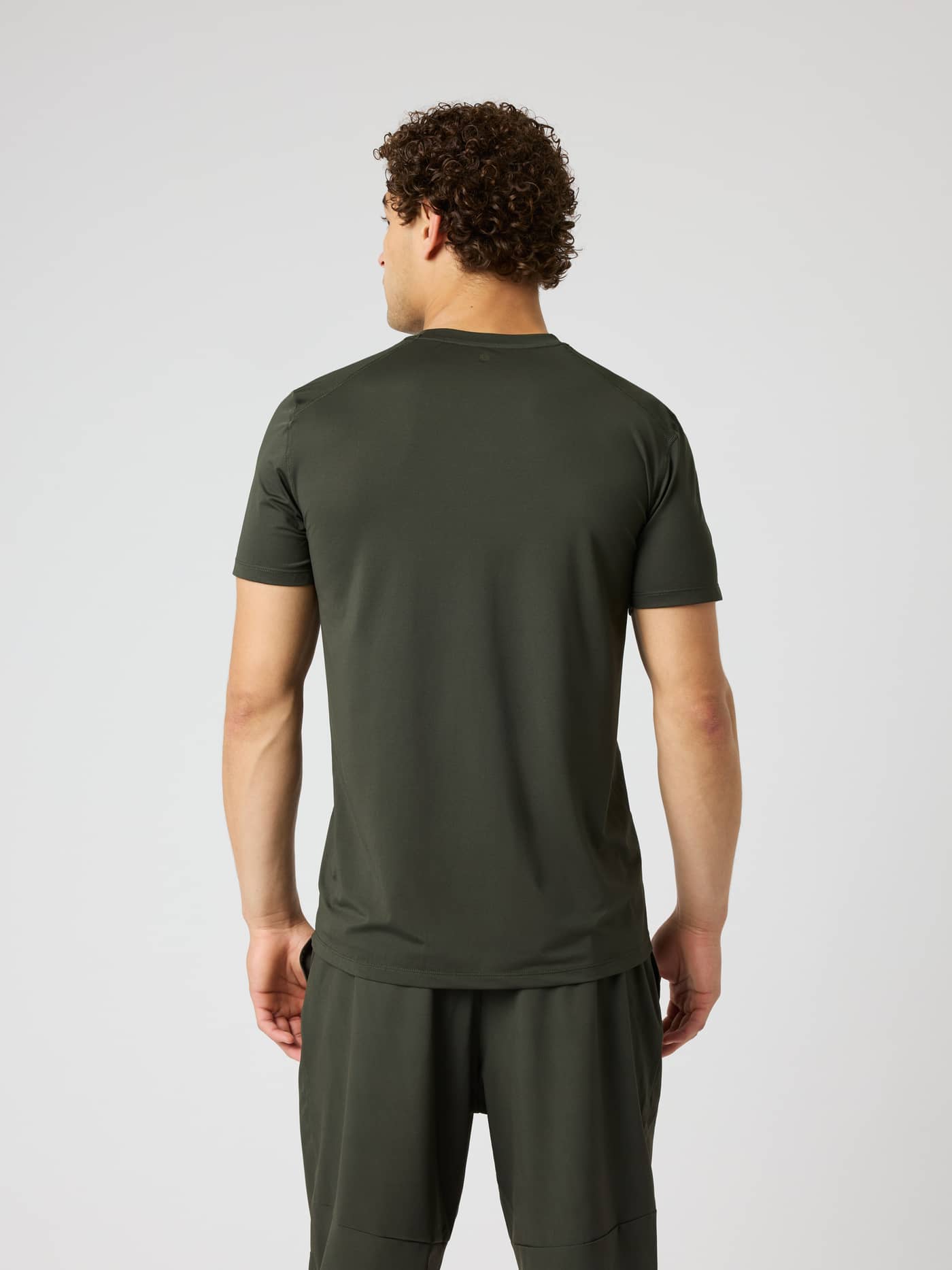 Borg Athletic T-Shirt in Rosin (Green) shown from the back, a technical moisture-wicking top for training and tennis. - Image 3