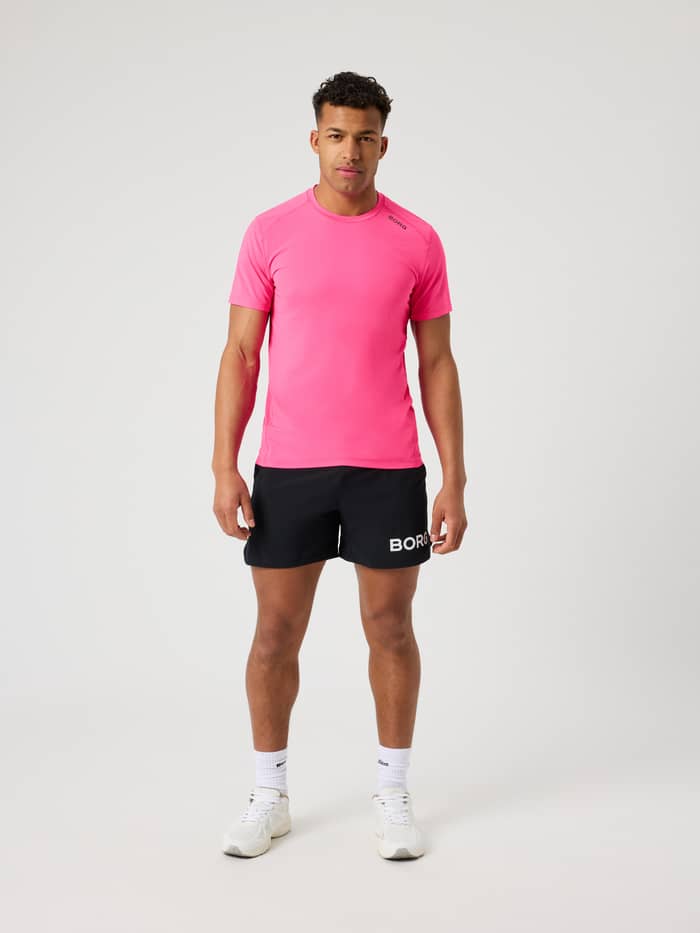 Borg Athletic T-Shirt i Pink Glo (Pink) set forfra på en mand med et sort logo til træning.