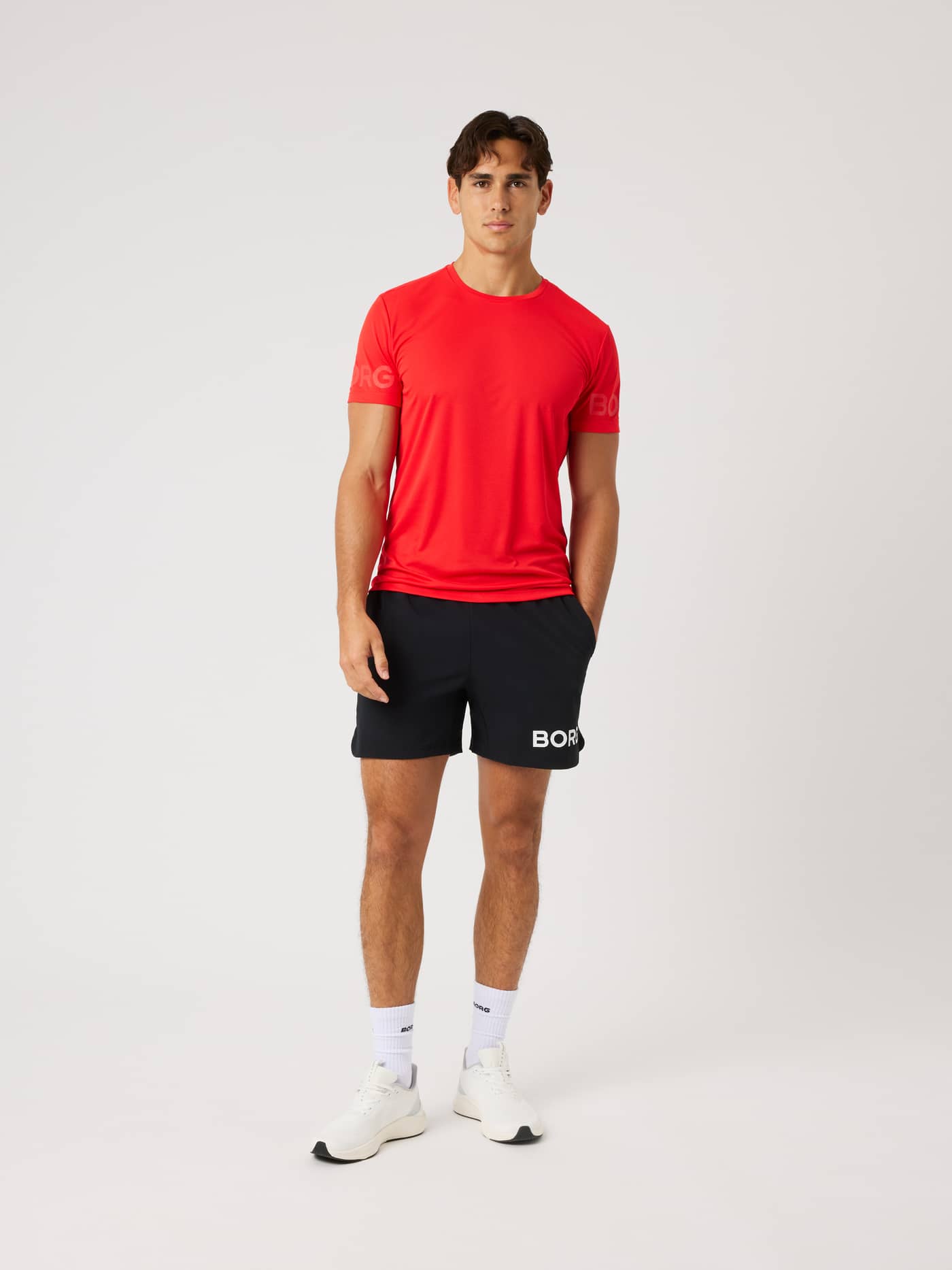 Front view of a model in the Borg Light T-Shirt in Flame Scarlet (Red), featuring a regular fit for active training. - Image 3