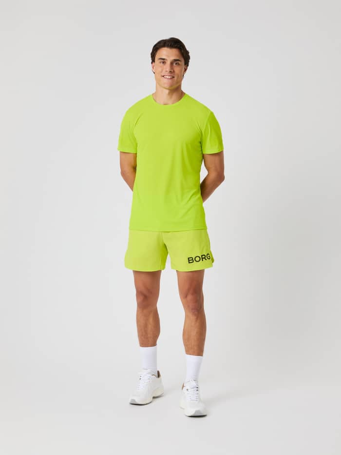Borg Light T-Shirt i Acid Lime (Grøn) set forfra på en mand, ideel til performance og træning. - Image 3