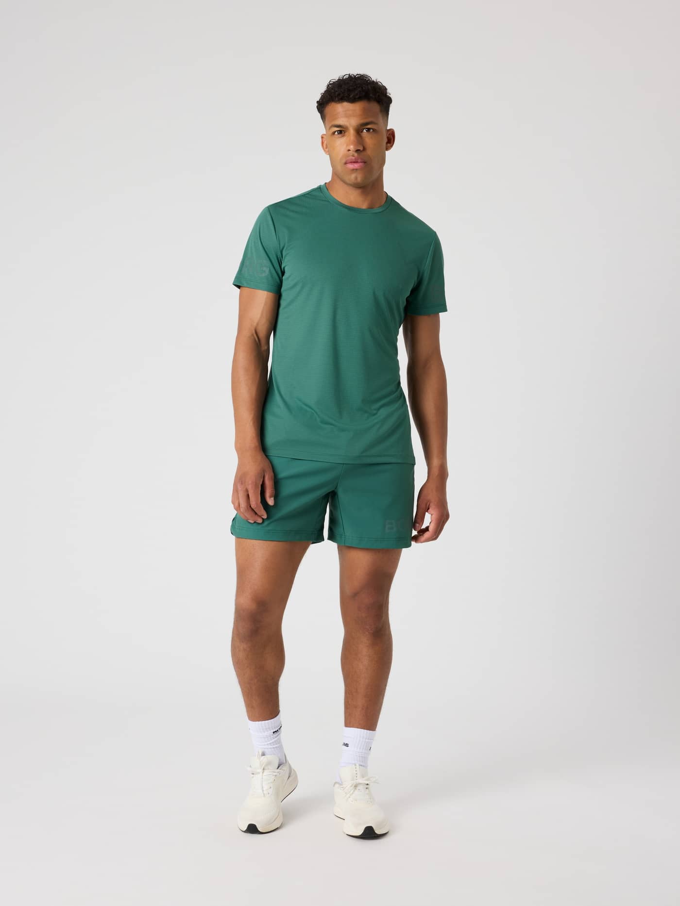 Full-body front view of a man wearing the functional Mallard Green (Green) Borg Light T-Shirt for training. - Image 3