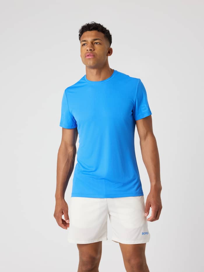 Vue de face d'un homme portant le Borg Light T-Shirt en Palace Blue (Bleu), un haut d'entraînement structuré.