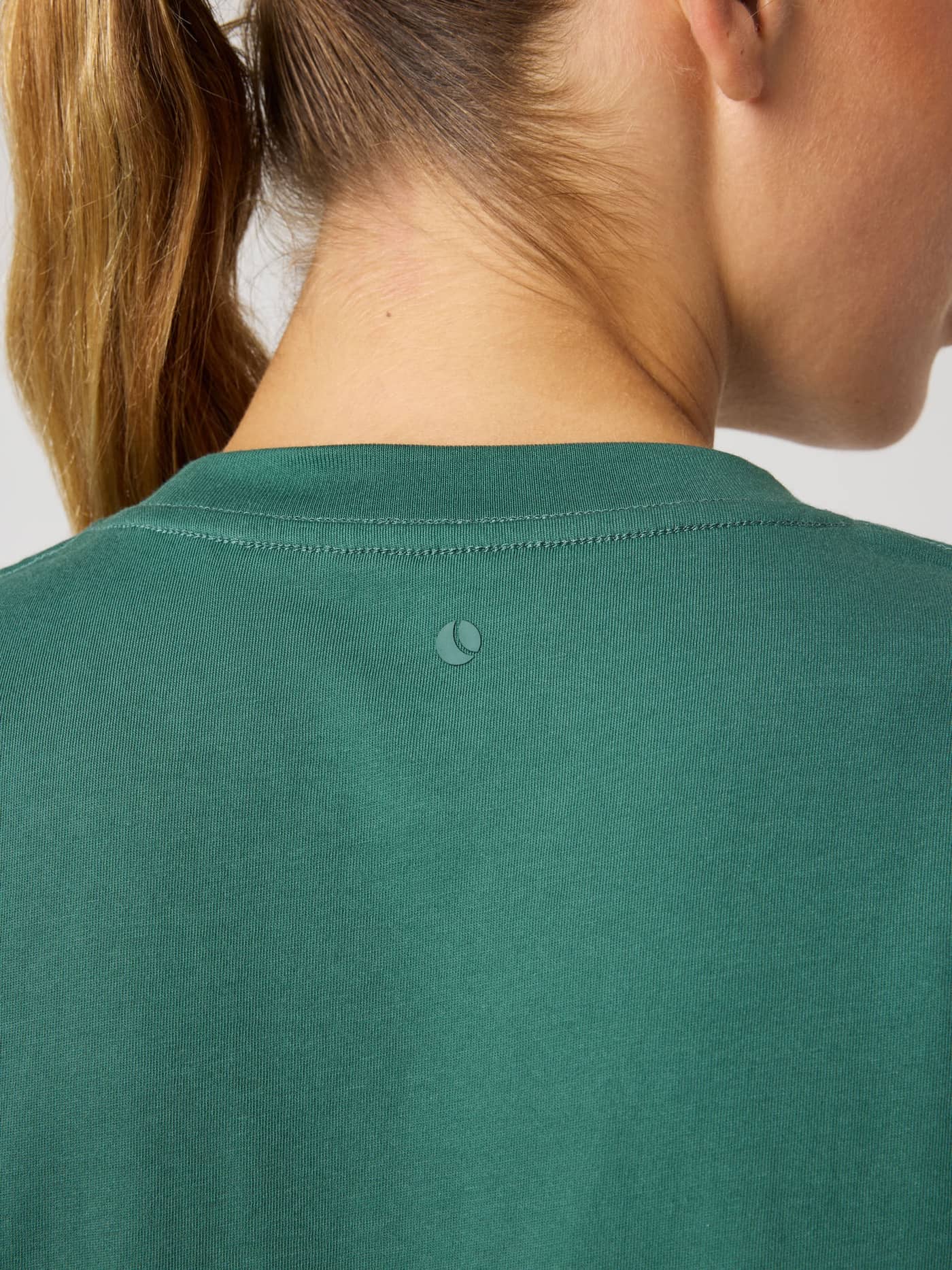 Back view of the Studio Oversized T-Shirt in Mallard Green (Green) showcasing a green tennis ball logo for studio training. - Image 5