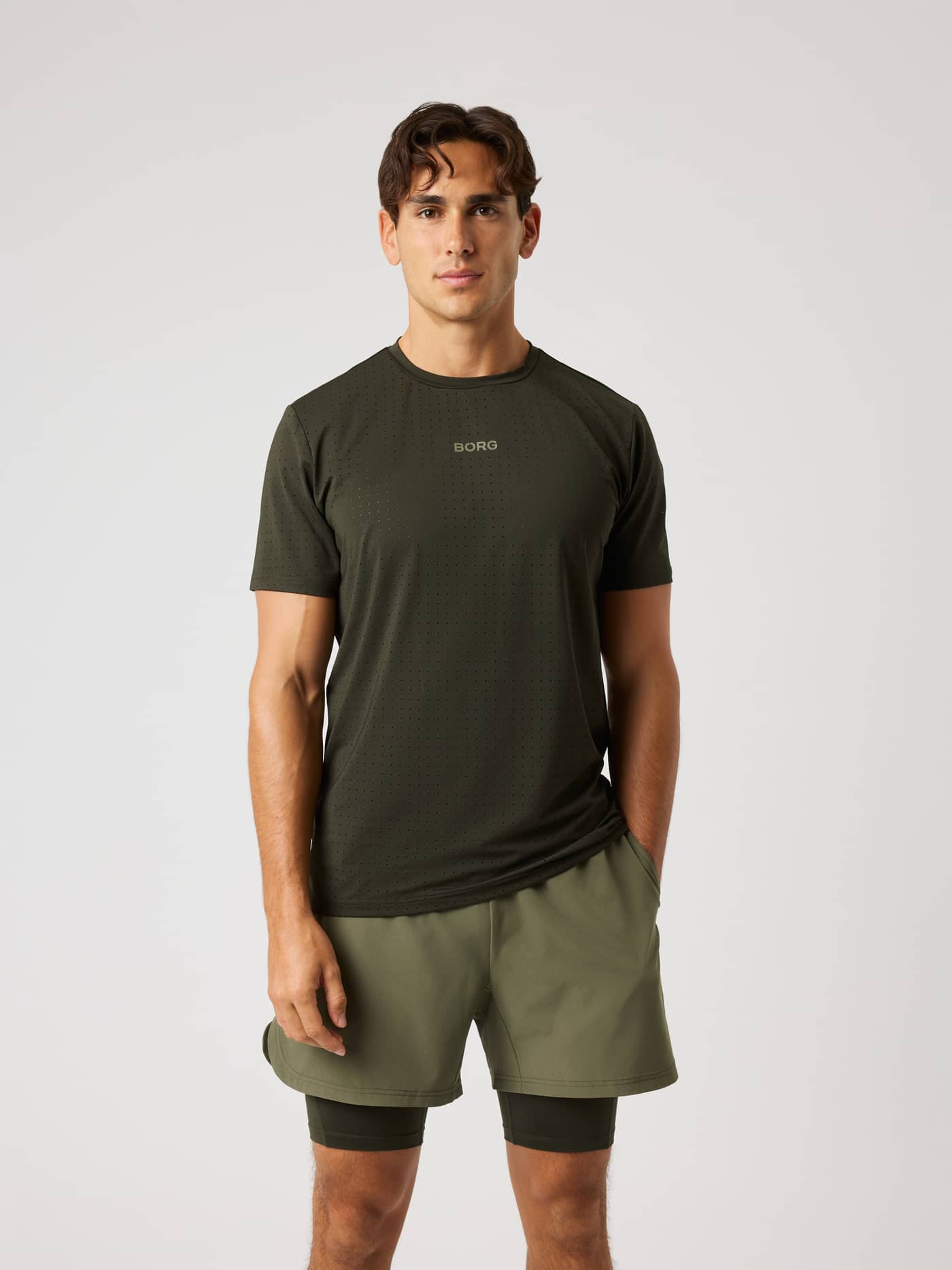 Front view of the Borg Performance Perforated T-Shirt in Rosin (Green) for running and training with a tonal green logo. - Image 1