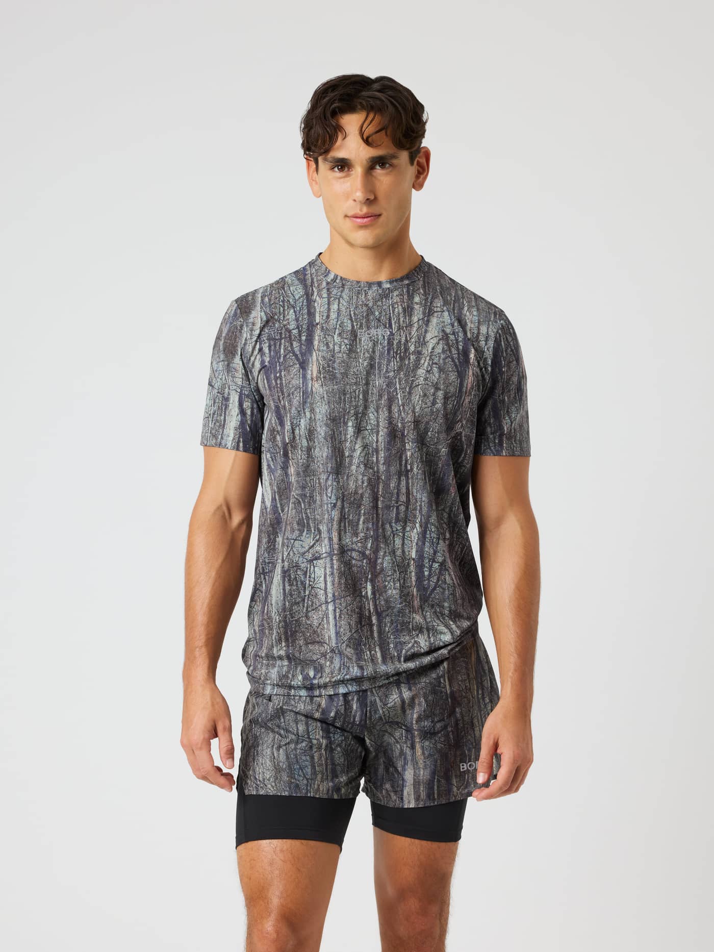Borg Performance Perforated T-Shirt in Forest 1 (Green) with a forest pattern and reflective logo for running. - Image 2