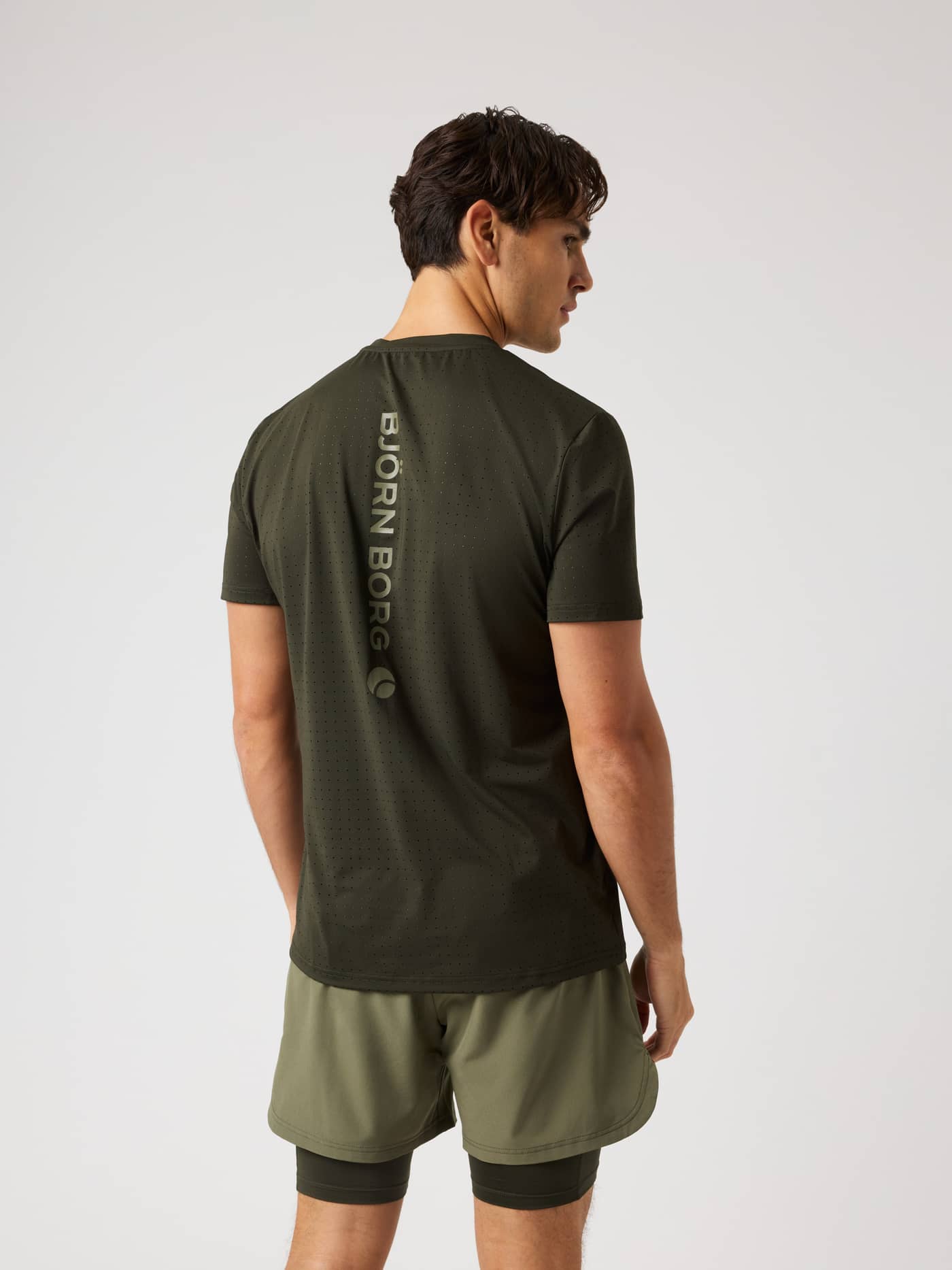 Back view of the Borg Performance Perforated T-Shirt in Rosin (Green) for breathable running, tennis, and training sessions. - Image 2