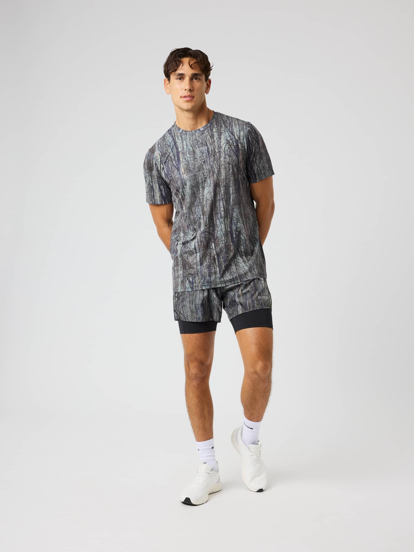 Front view of the Borg Performance Perforated T-Shirt in BB Forest 1 (Green) featuring a forest print for running. - Image 4