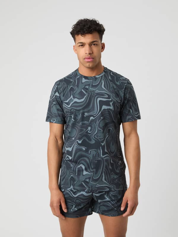 Borg Running Perforated T-Shirt i Liquid 1 (Grå) sedd framifrån med virvelmönster och svart logotyp för löpning.