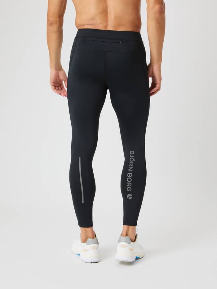 Rückansicht eines Mannes in den Borg Running Tights in Black Beauty (Schwarz) zum Laufen mit grauem, reflektierendem Logo. - Image 2
