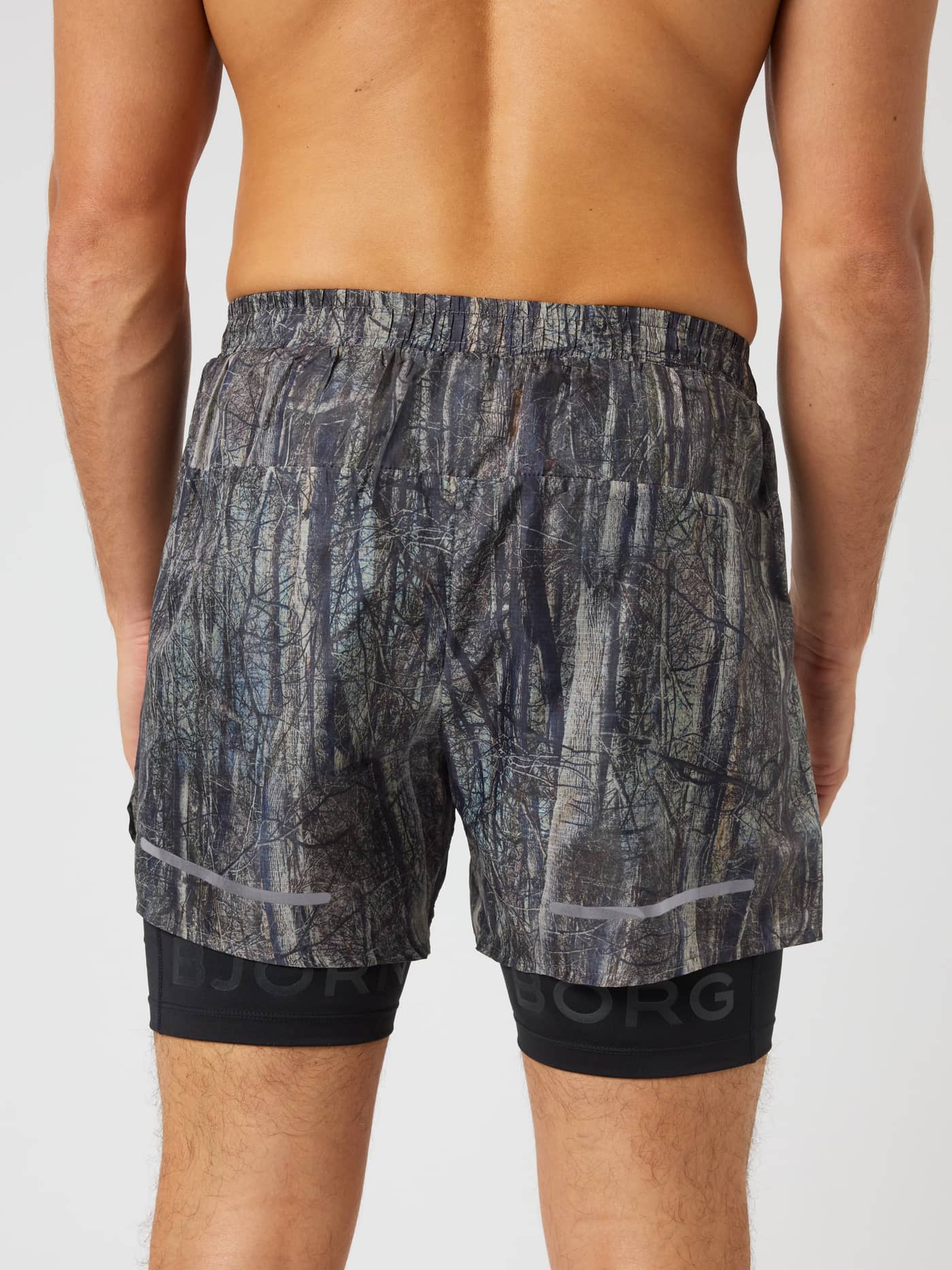 Back view of Borg Performance Shorts 2 In 1 in BB Forest 1 (Green) with a forest print and black logo for running. - Image 2