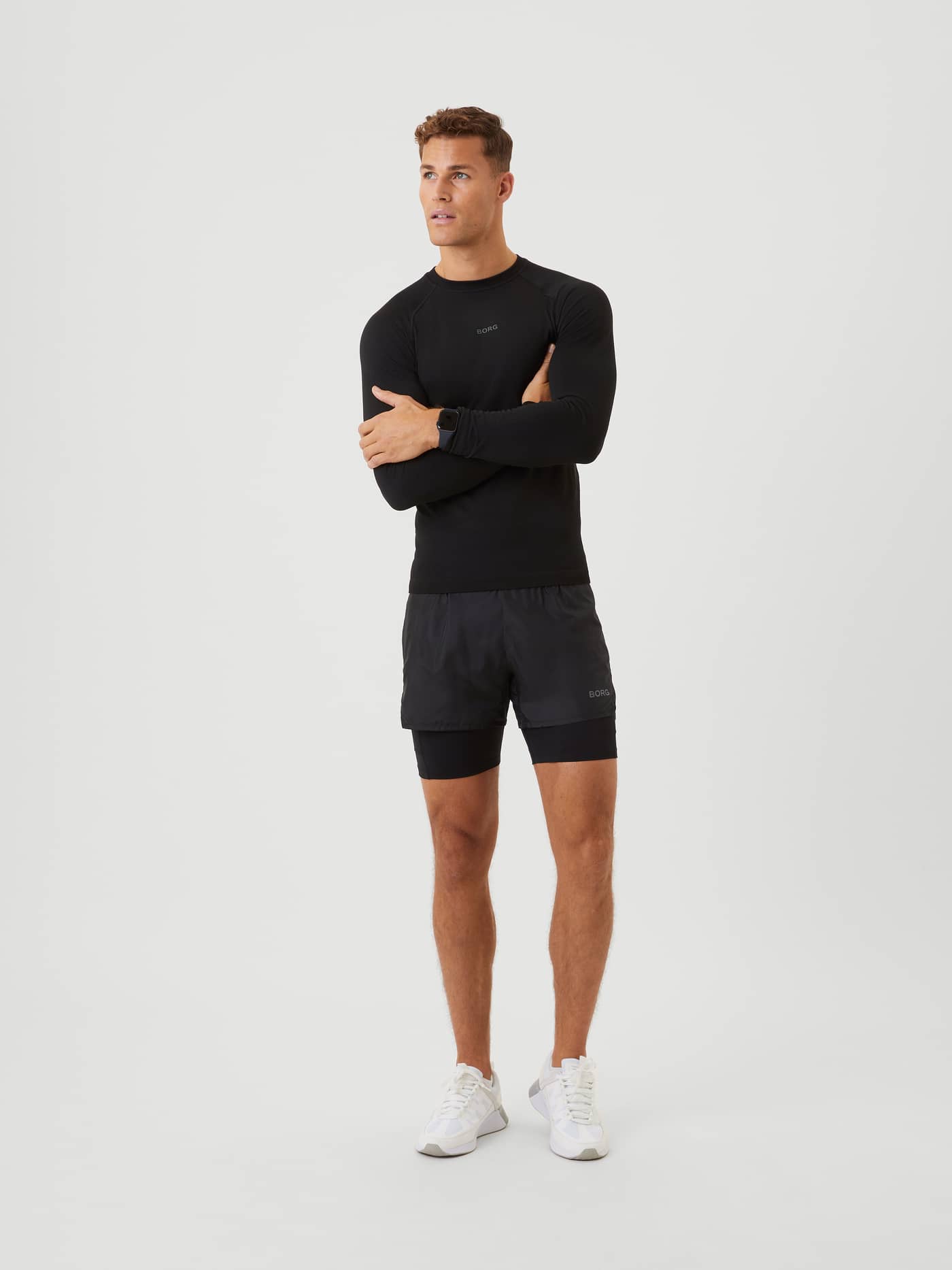 Full-body view of a man in functional Björn Borg Running Shorts 2 In 1 in Black Beauty (Black) for running and training. - Image 3