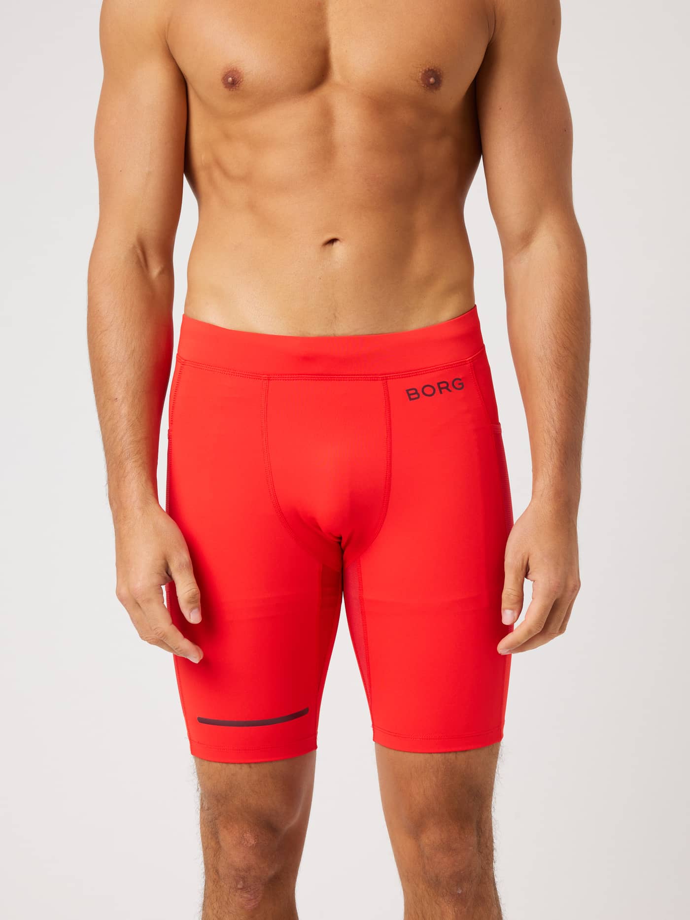 Front view of the Borg Performance Short Tights in Flame Scarlet (Red) for running, with a black logo and reflective strip. - Image 2