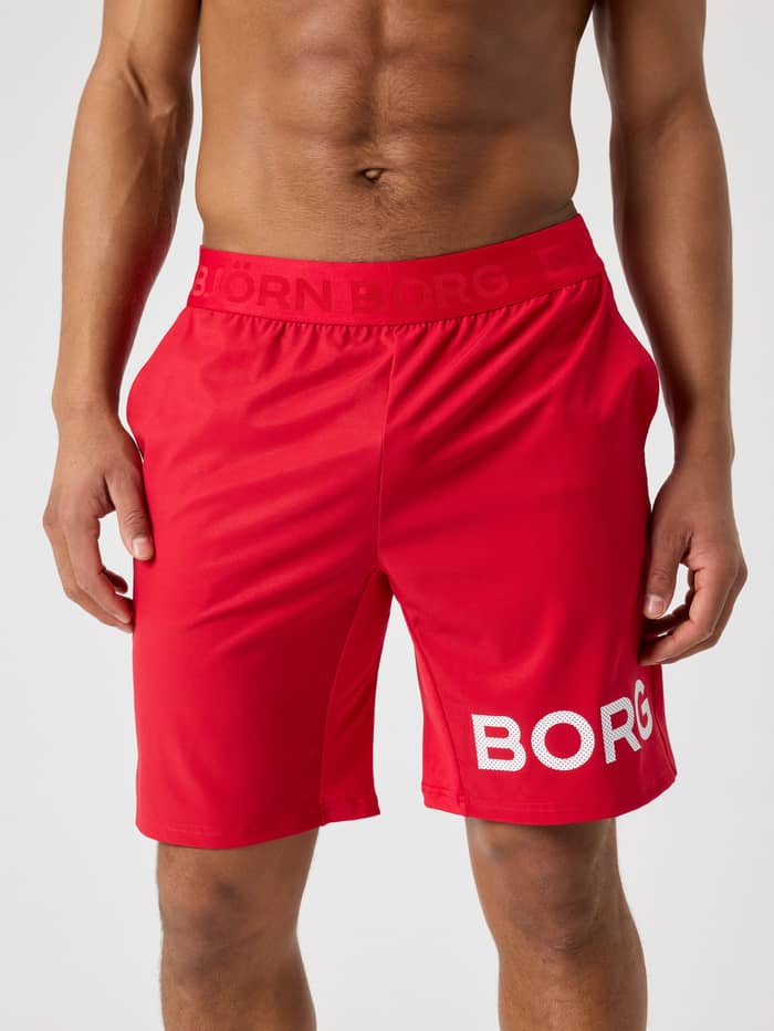 Borg Shorts 9 Inch i Lychee (Rød) til træning set forfra med et hvidt perforeret logo og genanvendt polyester.