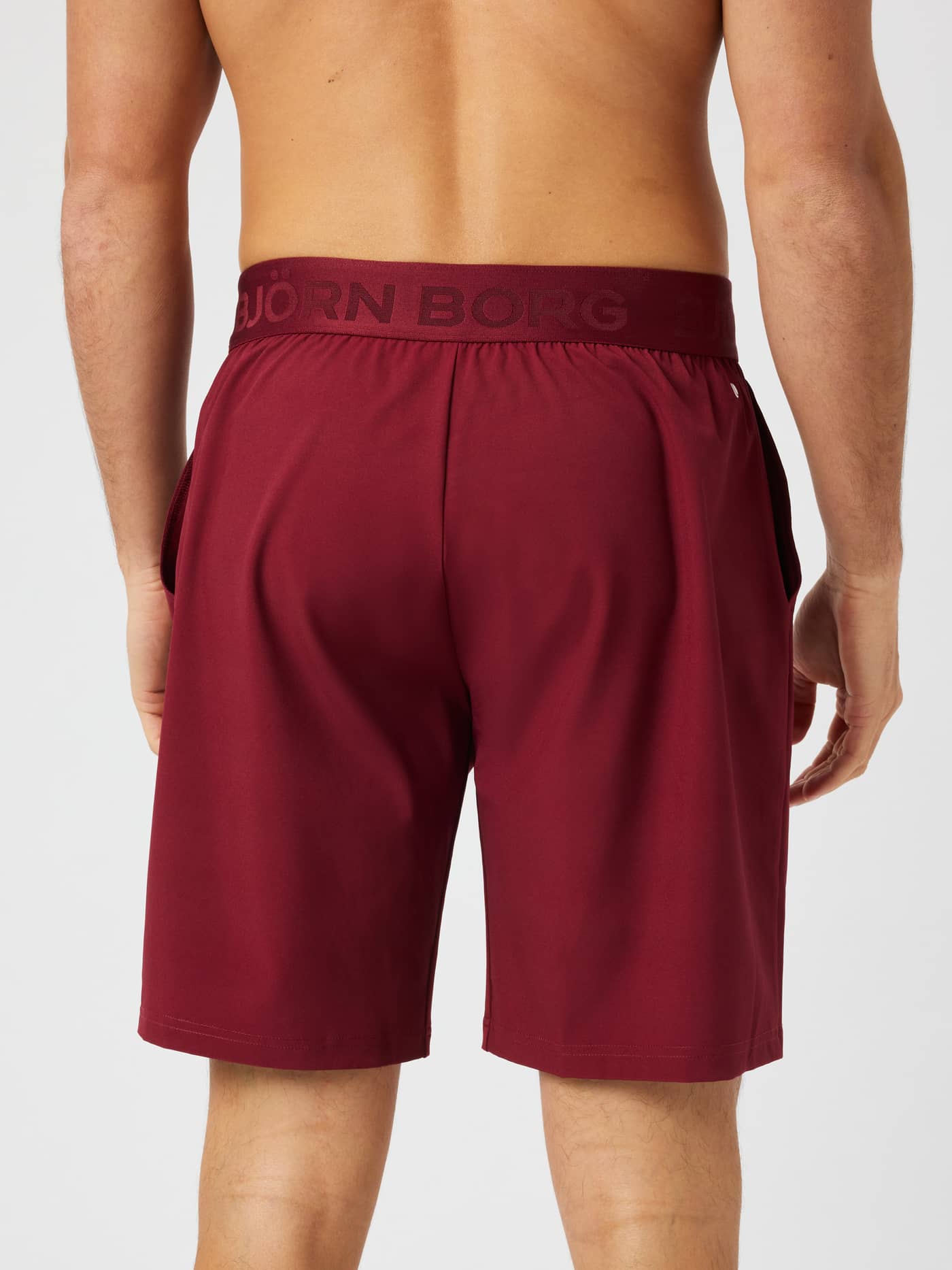 Rear view of the Borg Shorts 9 Inch in Cabernet (Red) featuring the elastic logo waistband for training. - Image 2