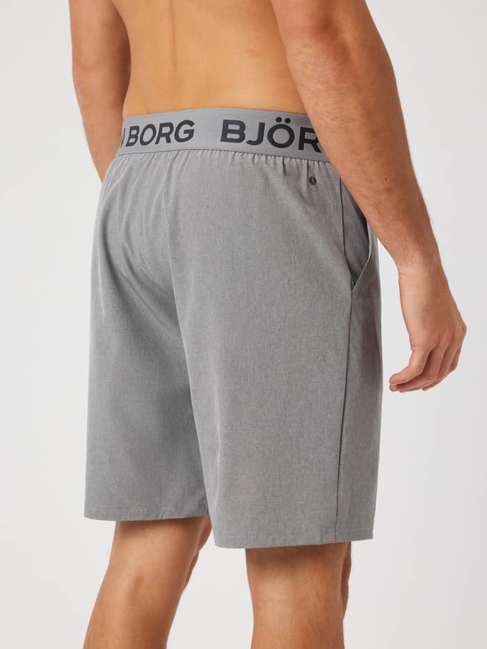 Rear view of Borg Shorts 9 Inch in Grey Melange (grey) with an elastic logo waistband for training.