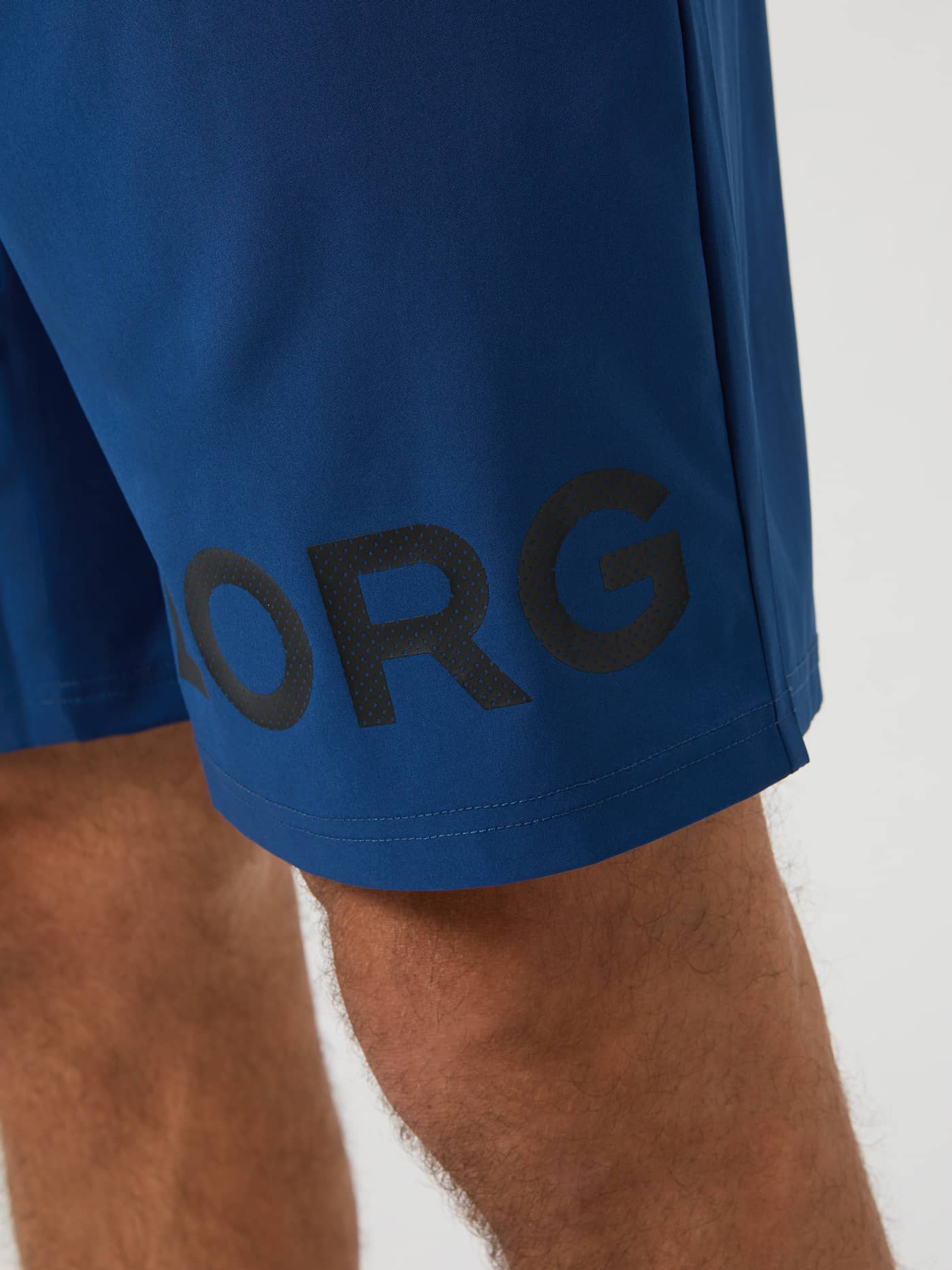 Close-up of the large black BORG logo on the leg of the Estate Blue Borg Shorts. - Image 4