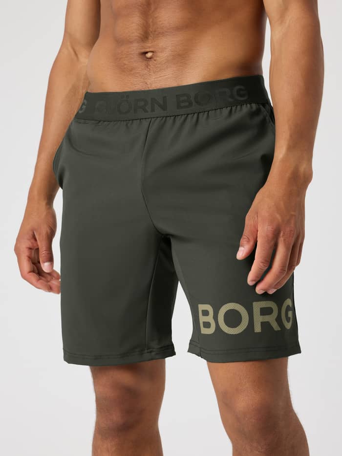 Vorderansicht der Borg Shorts 9 Inch in Rosin (Grün) zum Training mit Logo-Bund und perforiertem Logo.