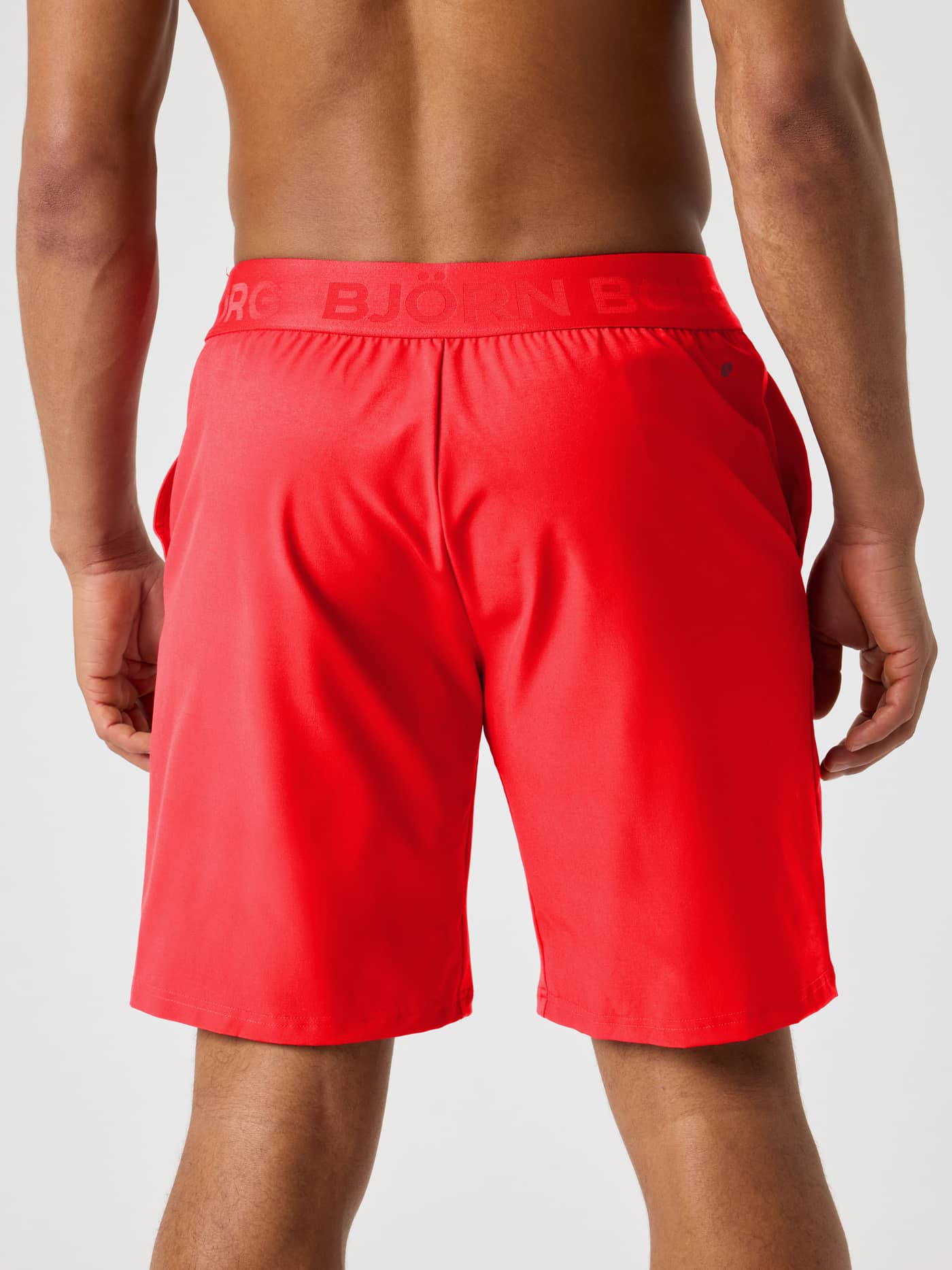 Back view of the Borg Shorts 9 Inch in Flame Scarlet (Red), featuring a tonal red logo waistband for training. - Image 2