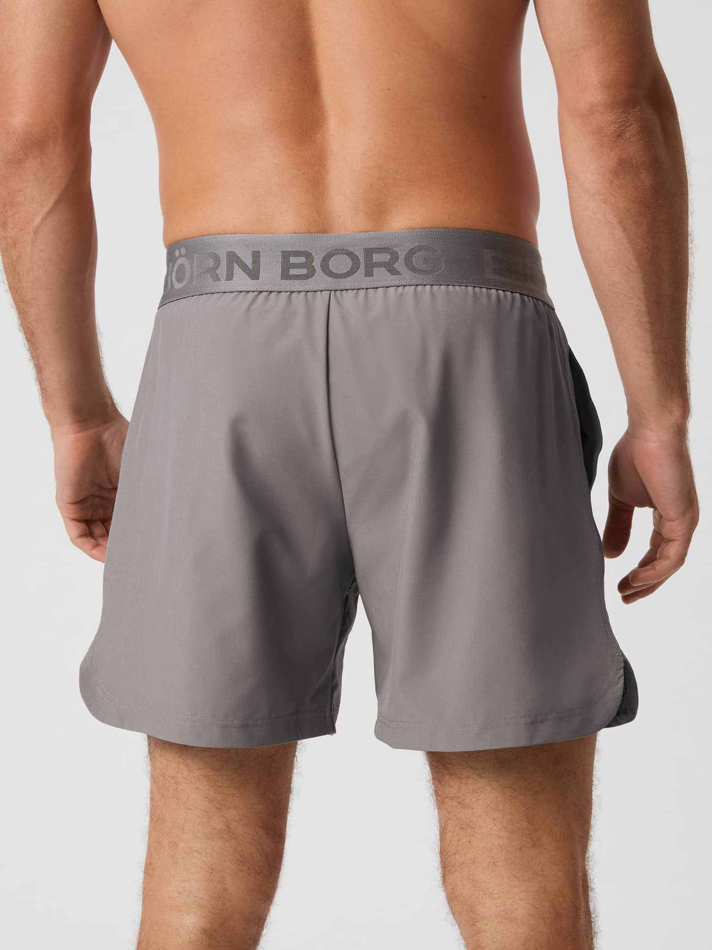 Back of a model wearing the grey Björn Borg BORG 6" SHORTS. - Image 2