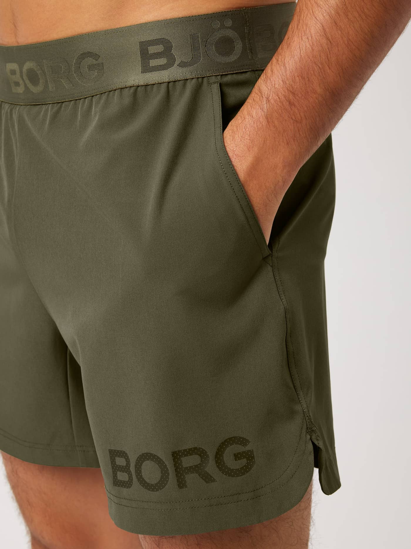 Kalamata (Green) Borg Shorts 6 Inch for training and tennis, featuring a tonal branded waistband and side pocket detail. - Image 4