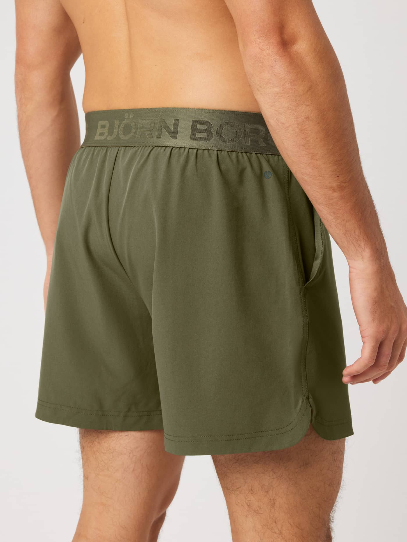 Back view of Borg Shorts 6 Inch in Kalamata (Green) for training and tennis, featuring a branded elastic waistband. - Image 2