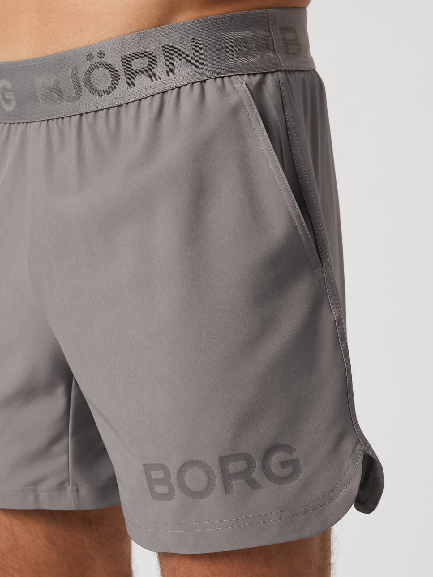 Close-up of the Björn Borg Borg 6" Shorts in grey, showing the branded waistband, side pocket and leg logo. - Image 4