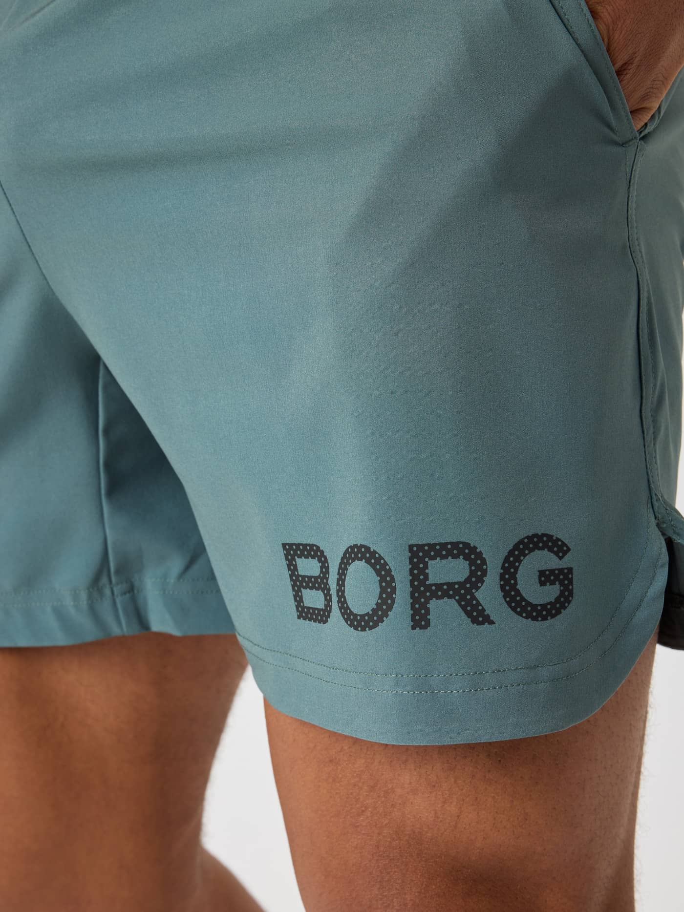 Borg Shorts 6 Inch for men's training in Balsam Green (Green) featuring a black BORG logo and functional side slit. - Image 5