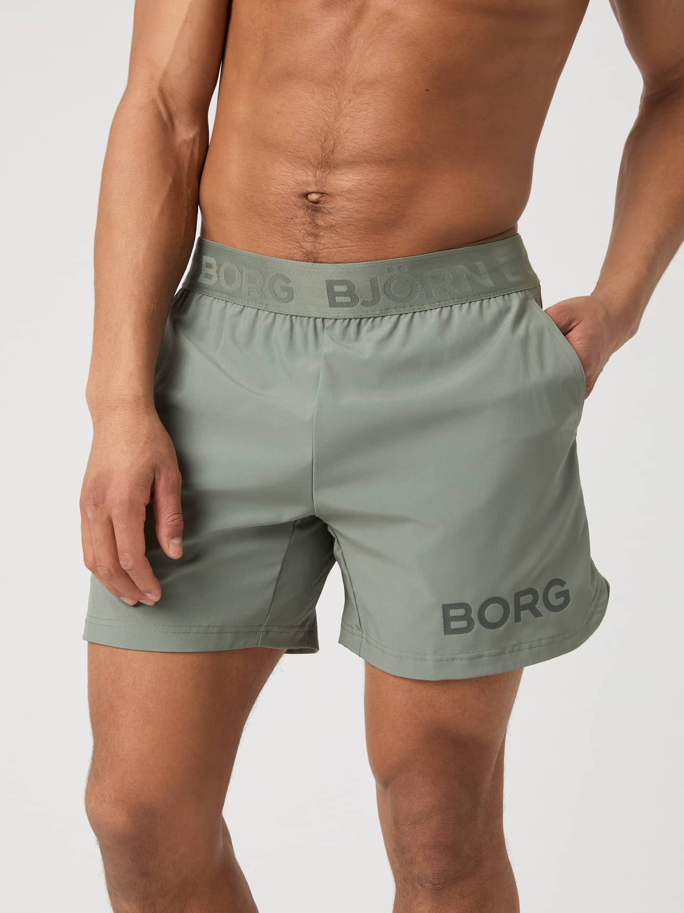 Front view of a model wearing the Björn Borg Borg 6" Shorts in Agave Green. - Image 1