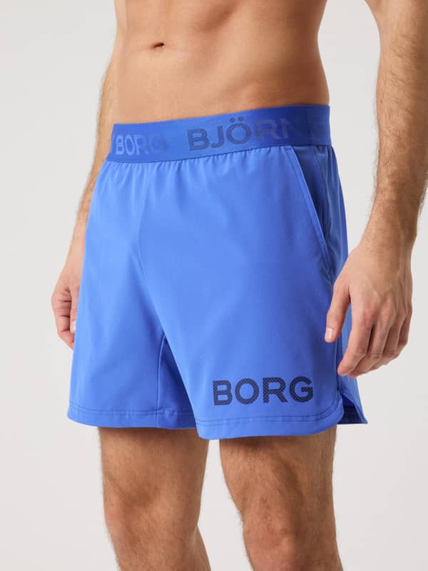 Front view of the men's training Borg Shorts 6 Inch in Amparo Blue (Blue), featuring a dark blue logo and performance fit.